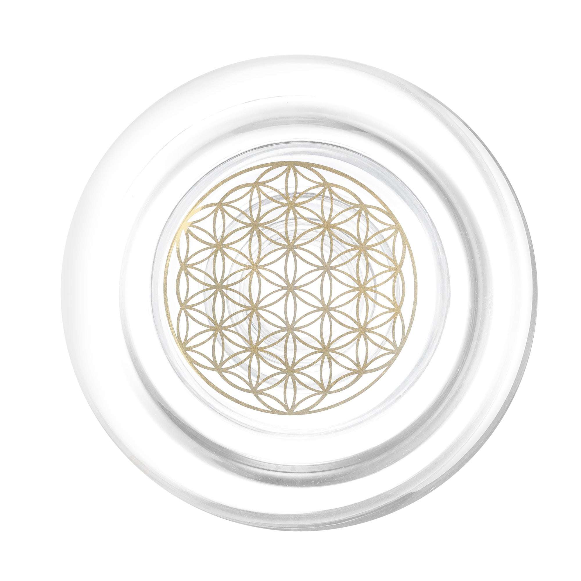 Ein kreisförmiges, durchsichtiges Glasobjekt mit goldfarbenem geometrischem Blumenmuster in der Mitte, von oben betrachtet.